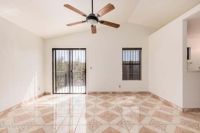 empty room featuring baseboards, light tile patterned floors, a ceiling fan, and lofted ceiling