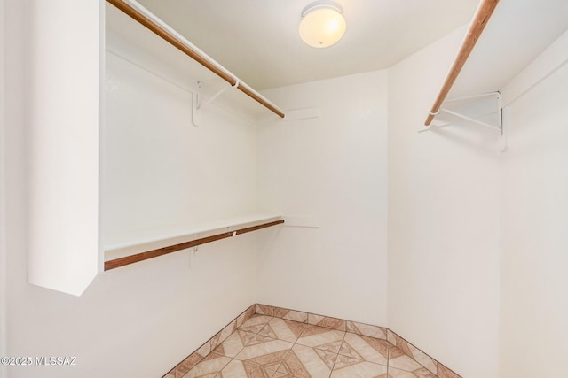 walk in closet featuring light tile patterned floors