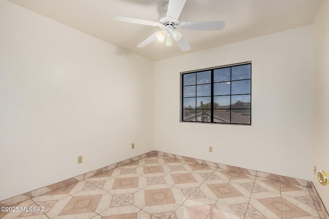 unfurnished room featuring light tile patterned floors and ceiling fan