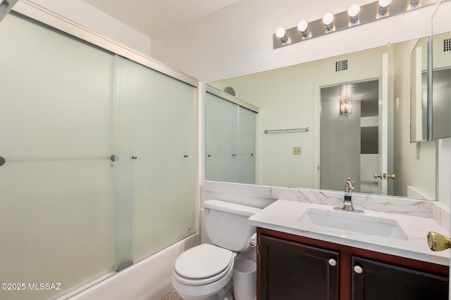 full bath with combined bath / shower with glass door, visible vents, toilet, and vanity