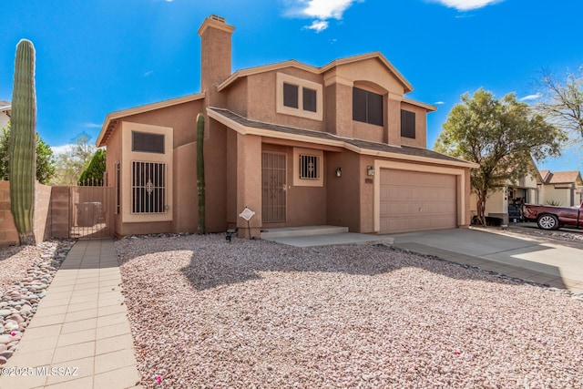 view of front of property featuring a chimney, stucco siding, concrete driveway, and a garage