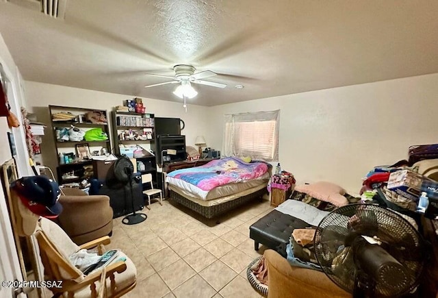 bedroom featuring ceiling fan and light tile patterned flooring
