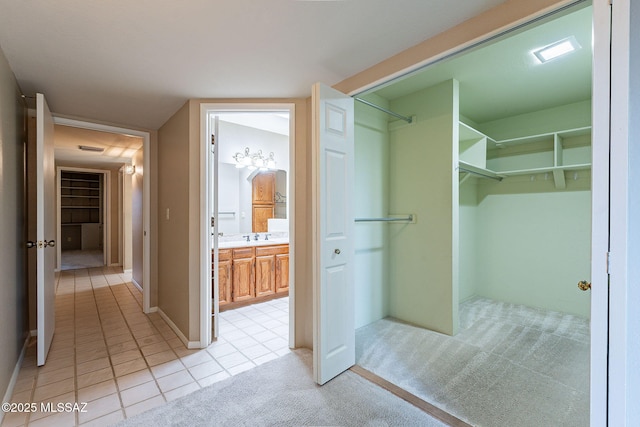 bathroom featuring tile patterned floors, visible vents, and vanity