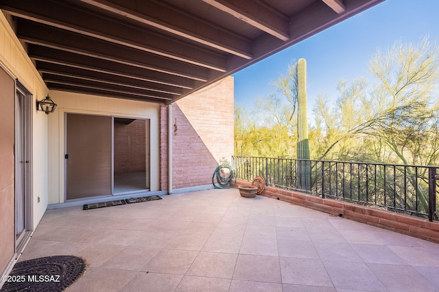 view of patio with a balcony