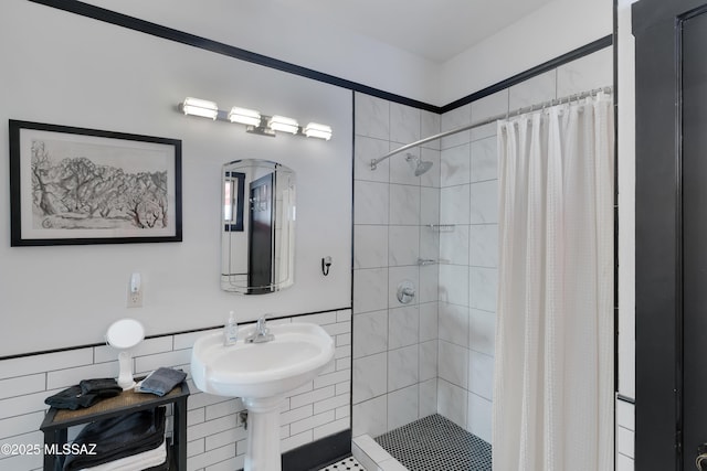 bathroom with tiled shower