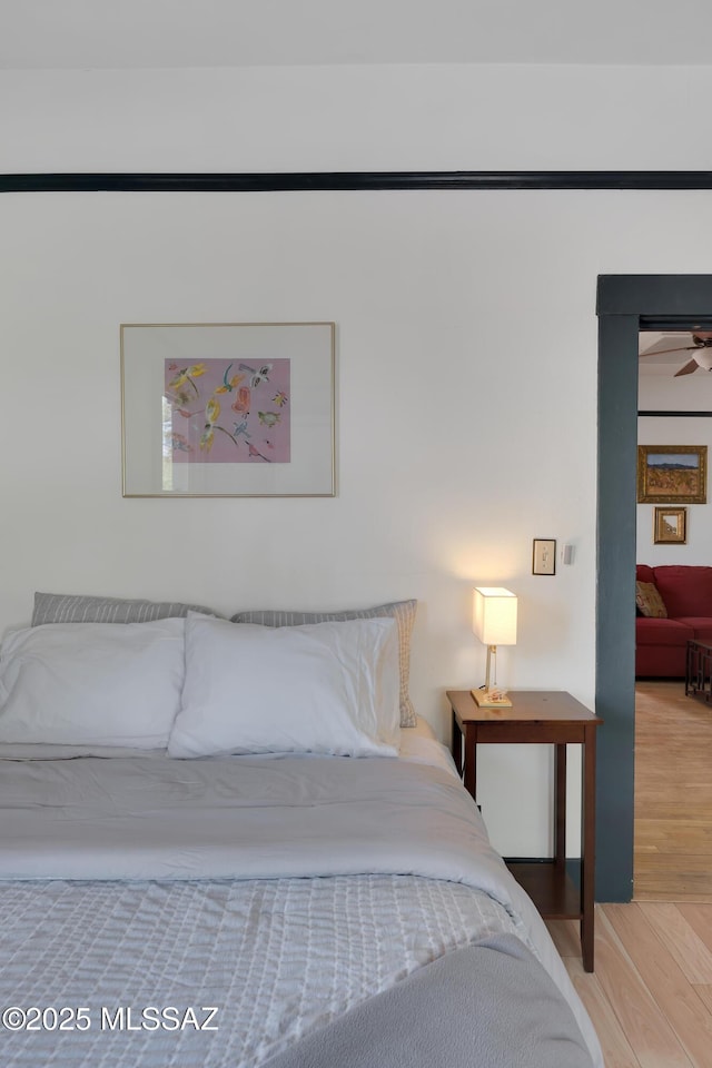 bedroom with wood finished floors