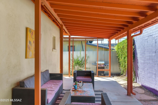 view of patio / terrace with an outdoor hangout area and fence