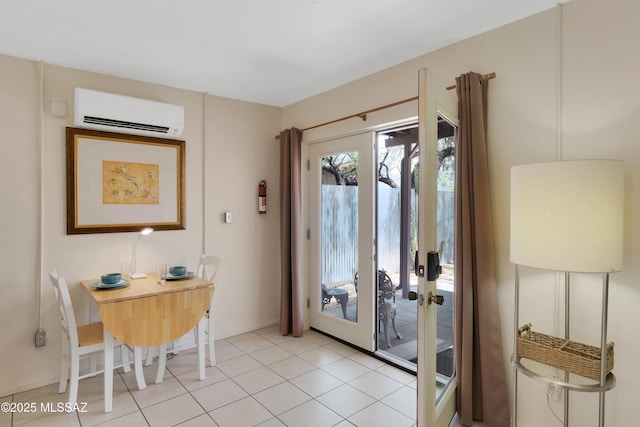 entrance foyer with a wall unit AC, light tile patterned floors, and french doors