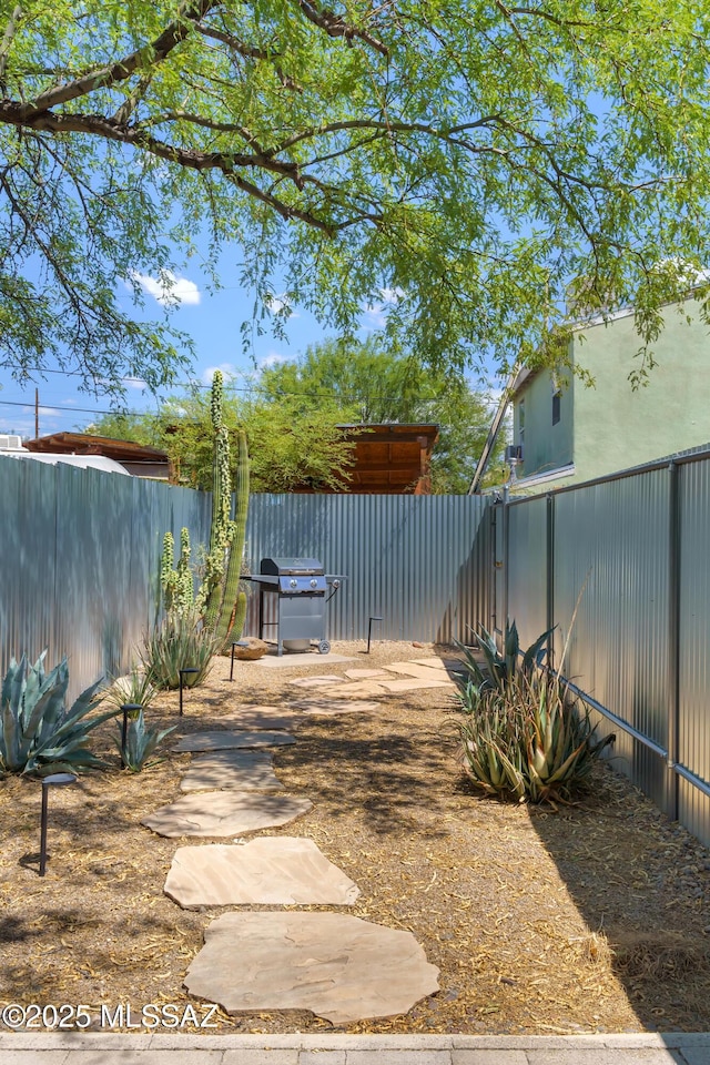 view of yard with a fenced backyard