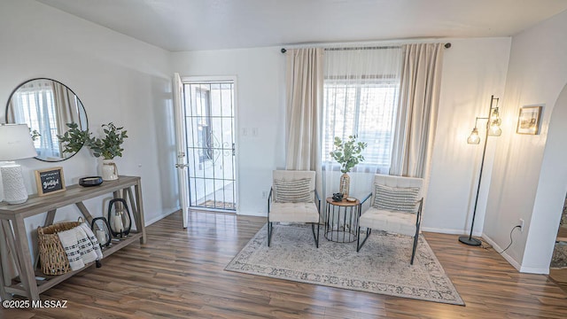 sitting room with wood finished floors and baseboards