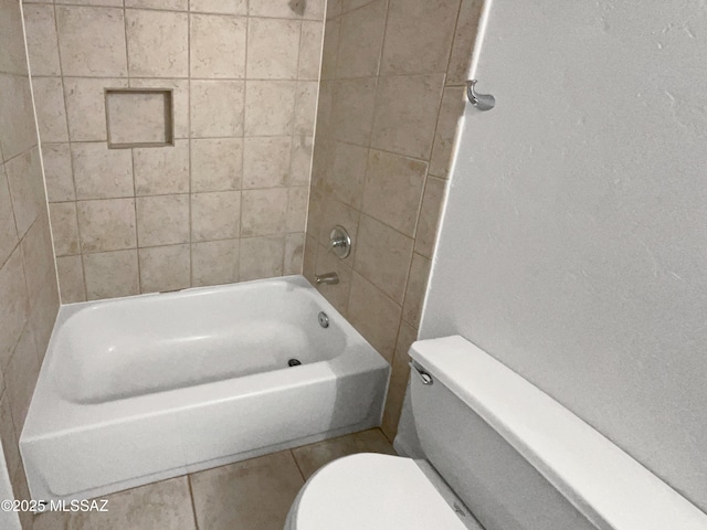 bathroom featuring toilet and shower / tub combination