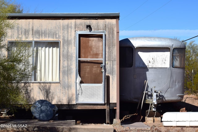 view of property exterior with an outdoor structure