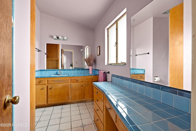 bathroom with vanity and backsplash