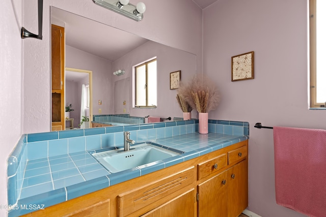 bathroom featuring vanity and vaulted ceiling