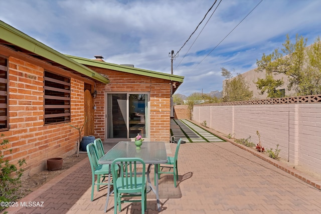 view of patio / terrace with a fenced backyard and outdoor dining space