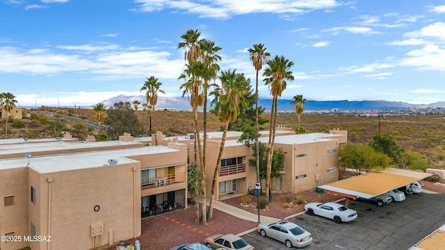 exterior space featuring uncovered parking and a mountain view