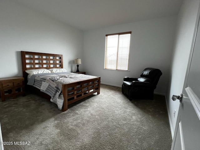 carpeted bedroom featuring baseboards