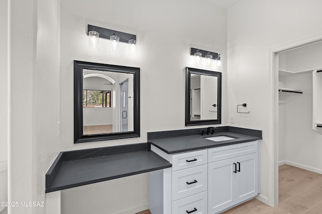 bathroom featuring vanity and wood finished floors