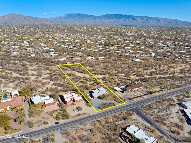 birds eye view of property featuring a mountain view