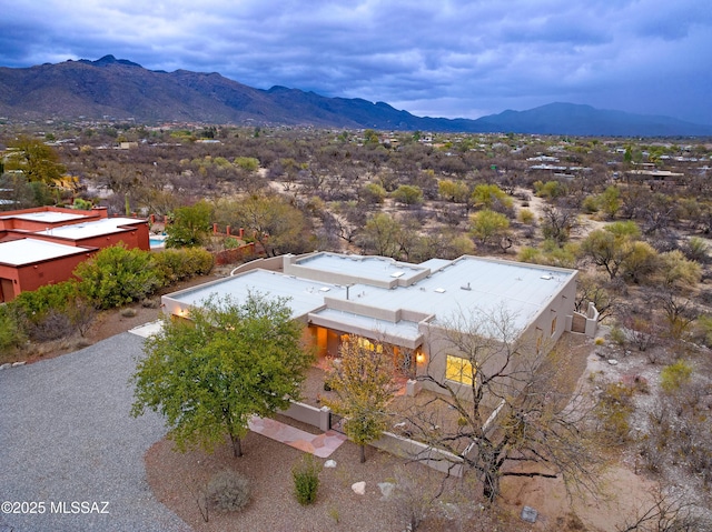 birds eye view of property with a mountain view