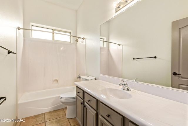 bathroom with tile patterned flooring, toilet, vanity, and bathtub / shower combination