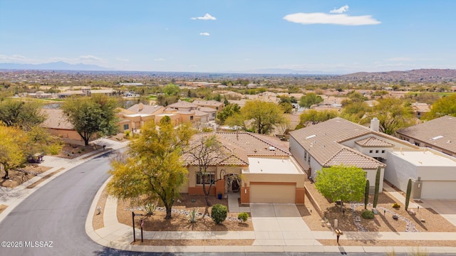 birds eye view of property featuring a mountain view and a residential view