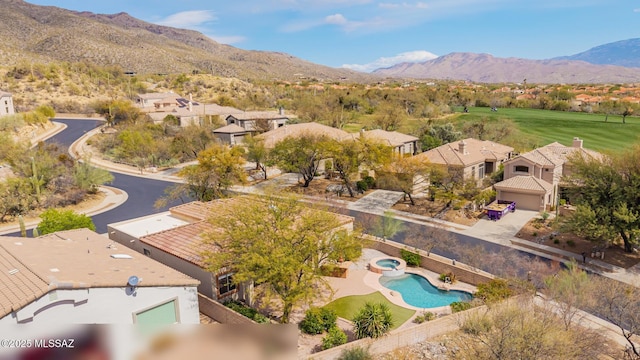 drone / aerial view with a mountain view and a residential view