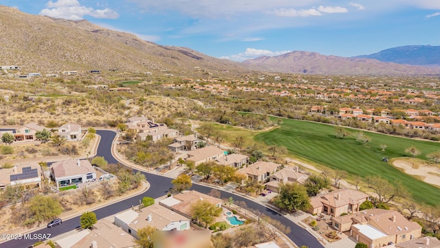 aerial view featuring a residential view, a mountain view, and view of golf course