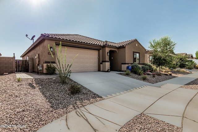 8707 N Ash Grove Ct, Tucson, AZ 85742 - mediterranean / spanish home featuring stucco siding, an attached garage, concrete driveway, and a tiled roof