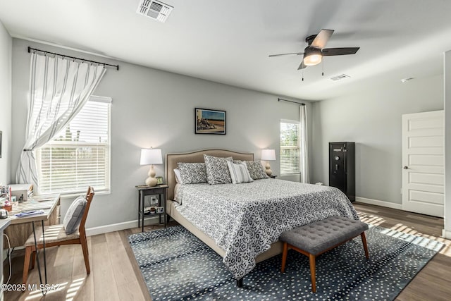 8707 N Ash Grove Ct, Tucson, AZ 85742 - bedroom featuring light wood finished floors and ceiling fan