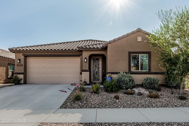 8707 N Ash Grove Ct, Tucson, AZ 85742 - mediterranean / spanish house with stucco siding, a tile roof, a garage, and driveway