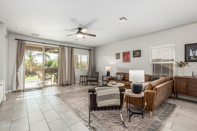 8707 N Ash Grove Ct, Tucson, AZ 85742 - living room featuring a ceiling fan and light tile patterned floors