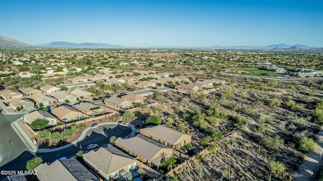 8707 N Ash Grove Ct, Tucson, AZ 85742 - aerial view of property's location with a mountainous background and nearby suburban area