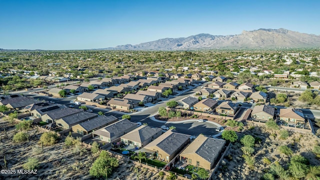8707 N Ash Grove Ct, Tucson, AZ 85742 - aerial view of property and surrounding area with a mountain backdrop and nearby suburban area
