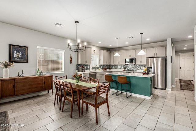 8707 N Ash Grove Ct, Tucson, AZ 85742 - dining space featuring recessed lighting, a chandelier, and light tile patterned floors