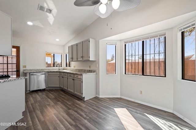 kitchen with stainless steel dishwasher, dark wood-type flooring, visible vents, and a sink