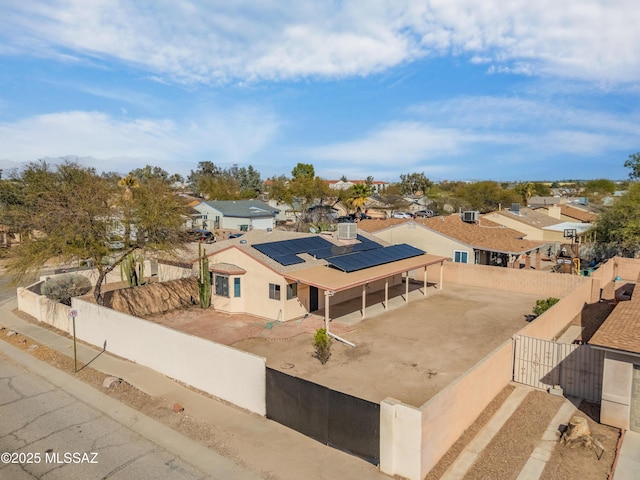 birds eye view of property with a residential view