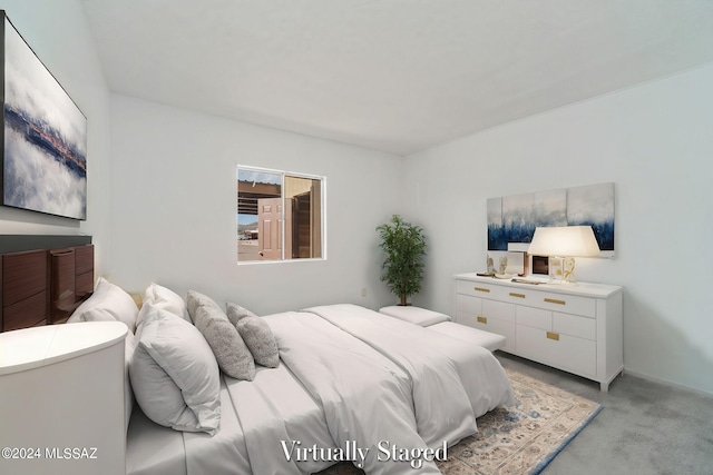 bedroom featuring light colored carpet