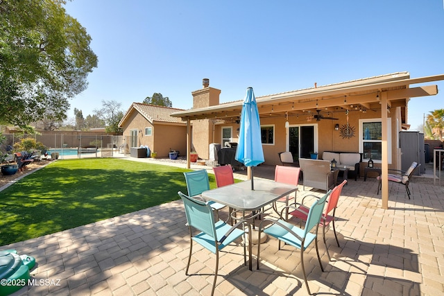 view of patio / terrace featuring outdoor dining space, a ceiling fan, fence, a fenced in pool, and an outdoor hangout area