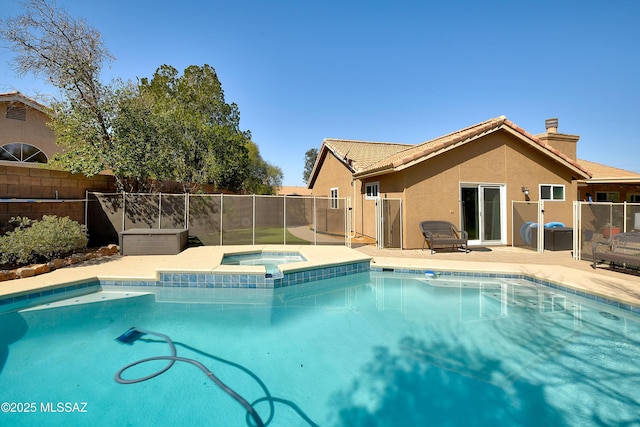 view of swimming pool featuring a fenced in pool, an in ground hot tub, a patio, and fence