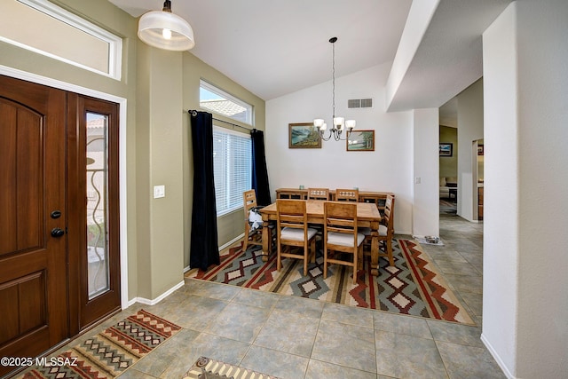 tiled dining room with visible vents, baseboards, a notable chandelier, and vaulted ceiling