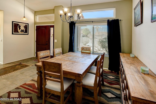 dining space featuring a notable chandelier