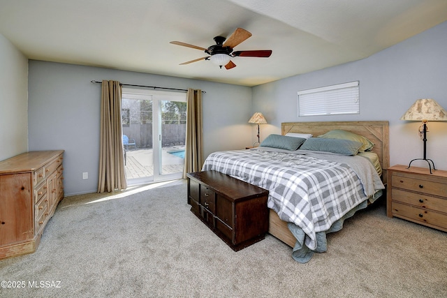 bedroom featuring access to exterior, carpet flooring, and a ceiling fan