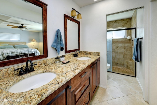 full bath with a sink, a stall shower, ensuite bath, and double vanity