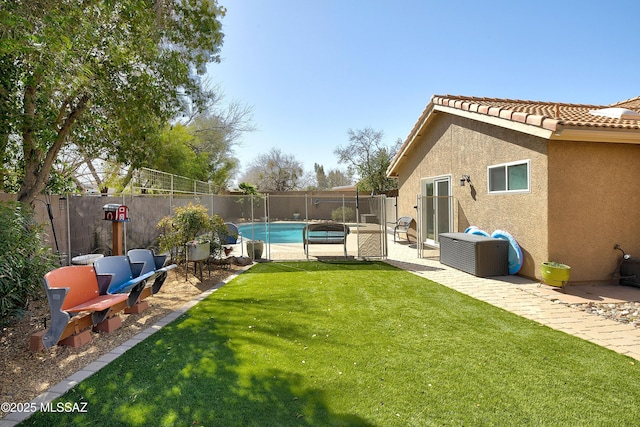 view of yard with a fenced in pool, a fenced backyard, and a patio area