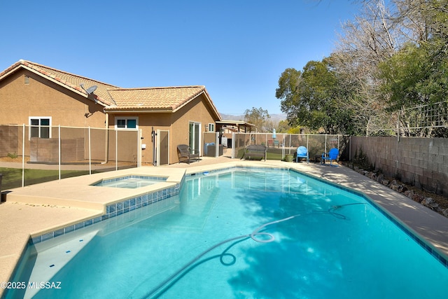 view of pool featuring a fenced in pool, an in ground hot tub, a fenced backyard, and a patio area