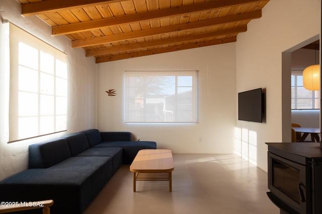 living room with concrete flooring, wooden ceiling, and vaulted ceiling with beams