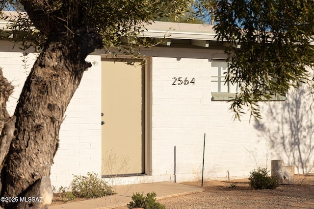 entrance to property with concrete block siding