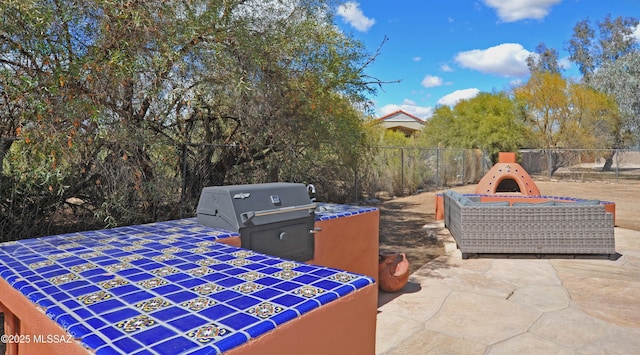 view of patio / terrace featuring fence