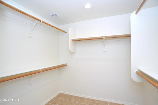 spacious closet featuring visible vents